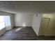 Bright living room featuring wood-look floors and natural light at 854 Stainglass Ln, Las Vegas, NV 89110