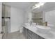 Modern bathroom featuring dual vessel sinks, elegant fixtures, walk-in glass shower and tile accents at 855 N Stephanie St # 2121, Henderson, NV 89014