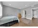 Comfortable bedroom boasts tiled floors, neutral gray color, closet and access to ensuite bathroom at 855 N Stephanie St # 2121, Henderson, NV 89014