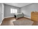 Cozy bedroom featuring tiled floors, window with shutters, dresser and warm neutral colors at 855 N Stephanie St # 2121, Henderson, NV 89014