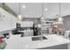Bright kitchen featuring stainless steel appliances, stone countertops, kitchen island, and eat-in kitchen space at 855 N Stephanie St # 2121, Henderson, NV 89014
