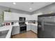 Spacious kitchen with stainless steel appliances, stone countertops, and gray and white cabinetry at 855 N Stephanie St # 2121, Henderson, NV 89014