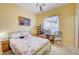 Cozy bedroom with carpet floors, a decorative window shade, and stylish furnishings at 9092 National Park Dr, Las Vegas, NV 89178