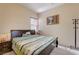 Cozy bedroom with plush carpeting and a quaint window for natural light at 9092 National Park Dr, Las Vegas, NV 89178