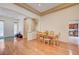 Inviting dining room featuring hardwood floors and an elegant archway design at 9092 National Park Dr, Las Vegas, NV 89178
