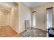Bright foyer with tile and wood floors, featuring a mirror and arched doorways at 9092 National Park Dr, Las Vegas, NV 89178