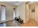 Elegant foyer with marble floors, wood floors, and natural light at 9092 National Park Dr, Las Vegas, NV 89178