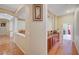 View of the open hallway with hardwood floors, built-in cabinets, and neutral color palette at 9092 National Park Dr, Las Vegas, NV 89178