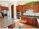 Modern kitchen with stainless steel double ovens, mosaic backsplash, and ample counter space at 9092 National Park Dr, Las Vegas, NV 89178