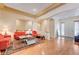 Spacious living room with an open floor plan and warm hardwood flooring at 9092 National Park Dr, Las Vegas, NV 89178