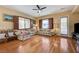 Cozy living room with natural light, plantation shutters, and hardwood floors at 9092 National Park Dr, Las Vegas, NV 89178
