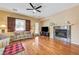 Comfortable living room featuring a fireplace and hardwood floors at 9092 National Park Dr, Las Vegas, NV 89178
