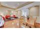 Open-concept area with hardwood floors, columns, living and dining areas at 9092 National Park Dr, Las Vegas, NV 89178