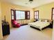 Spacious main bedroom with bay window, dark shutters, and a comfortable seating area at 9092 National Park Dr, Las Vegas, NV 89178