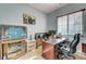 Bright home office with wall decor, a large window, and rolling office chair at 9092 National Park Dr, Las Vegas, NV 89178