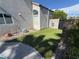 Cozy backyard with artificial grass and low-maintenance landscaping, creating a serene outdoor space at 9485 Supernova Ct, Las Vegas, NV 89123
