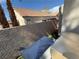 Backyard with patio furniture covered with blue tarp at 9485 Supernova Ct, Las Vegas, NV 89123