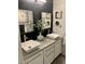 This modern bathroom boasts dual sinks and stylish vanities at 9485 Supernova Ct, Las Vegas, NV 89123