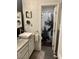 Bathroom featuring sleek vanity with square sink and view of shower with palm curtain at 9485 Supernova Ct, Las Vegas, NV 89123