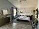 Relaxing bedroom with brick-look accent wall and ample light at 9485 Supernova Ct, Las Vegas, NV 89123