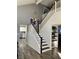 Bright entryway showcasing an open staircase and modern fixtures at 9485 Supernova Ct, Las Vegas, NV 89123