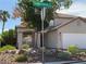 Charming single Gathering house on corner lot with desert landscaping, two-car garage, and tile roof at 9485 Supernova Ct, Las Vegas, NV 89123