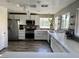 Spacious kitchen featuring stainless steel appliances, quartz countertops, and ample cabinetry at 9485 Supernova Ct, Las Vegas, NV 89123