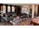 Spacious living room with a pool table and comfortable seating arrangement, perfect for entertaining at 9485 Supernova Ct, Las Vegas, NV 89123