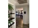 View into a bright living room with pool table, through a hallway with decorative shelving at 9485 Supernova Ct, Las Vegas, NV 89123