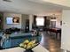 Spacious living room with stylish furnishings, pool table, and an open view to the kitchen at 9485 Supernova Ct, Las Vegas, NV 89123