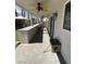 Covered patio with outdoor kitchen, complete with bar seating and a built-in grill at 9485 Supernova Ct, Las Vegas, NV 89123