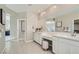 Spacious primary bathroom featuring dual sinks, a vanity, and modern fixtures at 9576 Archer Peak Ct, Las Vegas, NV 89143