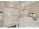 Bathroom with white subway tile shower, chrome accents and vanity with countertop at 9576 Archer Peak Ct, Las Vegas, NV 89143