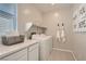 Laundry room features white washer/dryer and quartz countertops with a window view at 9576 Archer Peak Ct, Las Vegas, NV 89143