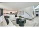 Bright and airy living area with contemporary decor and seamless flow into the modern kitchen at 9576 Archer Peak Ct, Las Vegas, NV 89143