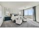 Spacious primary bedroom featuring carpeted floors, balcony access, and neutral decor at 9576 Archer Peak Ct, Las Vegas, NV 89143