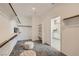 Spacious walk-in closet with custom shelving, carpeted floors, and natural light at 9576 Archer Peak Ct, Las Vegas, NV 89143