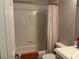 Traditional bathroom with a tiled shower/tub combination, a sink, and a toilet at 9753 Arrowcrest Ave, Las Vegas, NV 89147