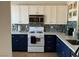 Modern kitchen featuring stainless steel appliances, stylish countertops, and white cabinets at 9753 Arrowcrest Ave, Las Vegas, NV 89147