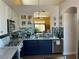 Modern kitchen with stainless steel appliances, white countertops, and beautiful backsplash at 9753 Arrowcrest Ave, Las Vegas, NV 89147
