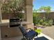 Built-in outdoor kitchen includes a grill and counter space, perfect for entertaining in the backyard at 9753 Arrowcrest Ave, Las Vegas, NV 89147