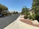 Well-maintained streetscape with lush landscaping, mature trees, and beautiful homes at 9753 Arrowcrest Ave, Las Vegas, NV 89147