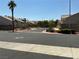 Serene street view with manicured landscaping and well-maintained homes in a quiet neighborhood at 9753 Arrowcrest Ave, Las Vegas, NV 89147