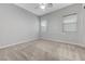 Bedroom with neutral walls, carpet, and dual windows allowing natural light at 977 Edinburgh Fields Ct, Las Vegas, NV 89138