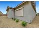 Home exterior with roll down shade and minimal landscaping at 977 Edinburgh Fields Ct, Las Vegas, NV 89138