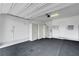 Spacious, well-lit garage with ample storage cabinets and plenty of room for vehicles and projects at 977 Edinburgh Fields Ct, Las Vegas, NV 89138