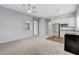 Open-concept living space with a modern kitchen and a large window at 977 Edinburgh Fields Ct, Las Vegas, NV 89138