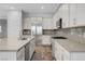Modern kitchen with stainless steel appliances, granite countertops, and white cabinetry at 977 Edinburgh Fields Ct, Las Vegas, NV 89138