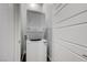 A white stackable washer and dryer set beside a white door at 977 Edinburgh Fields Ct, Las Vegas, NV 89138