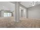 Spacious living room with neutral carpet, recessed lighting, and sliding glass doors to the backyard at 977 Edinburgh Fields Ct, Las Vegas, NV 89138